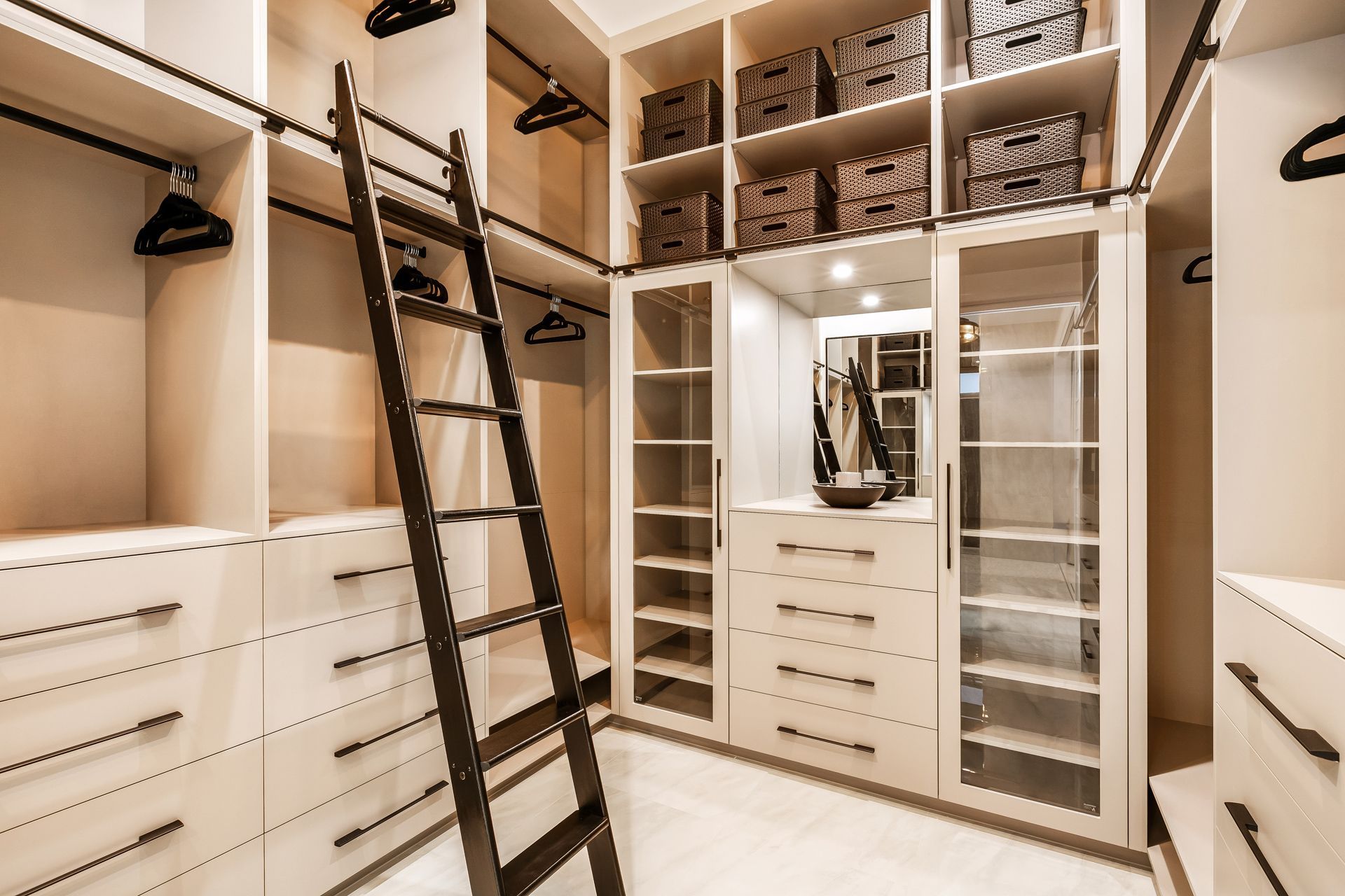 A Modern, White Walk-in Closet With Integrated Storage — Ashlee Jones Homes in Gordonvale, QLD