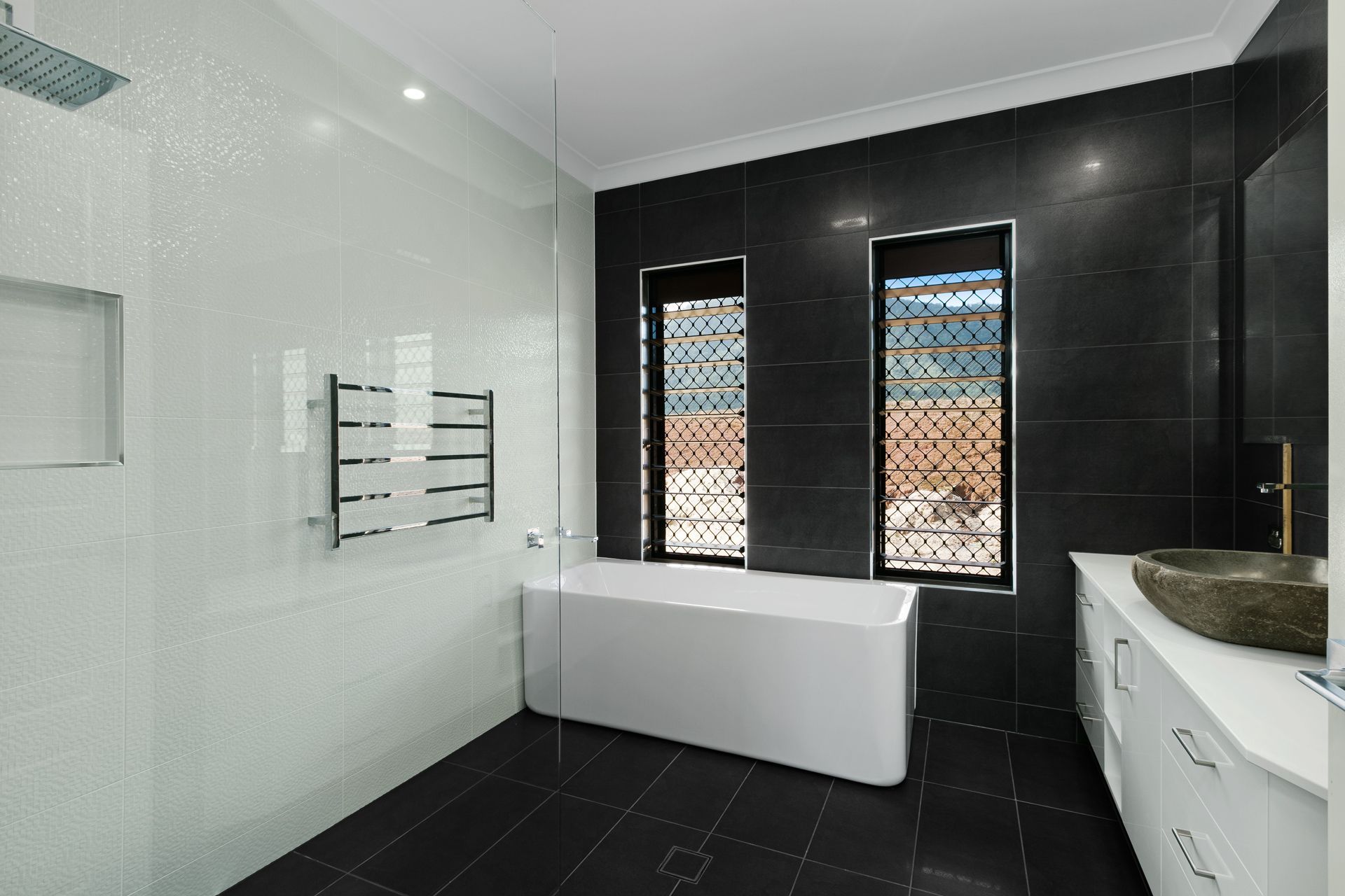 Modern Bathroom With a White Freestanding Bathtub — Ashlee Jones Homes in Gordonvale, QLD