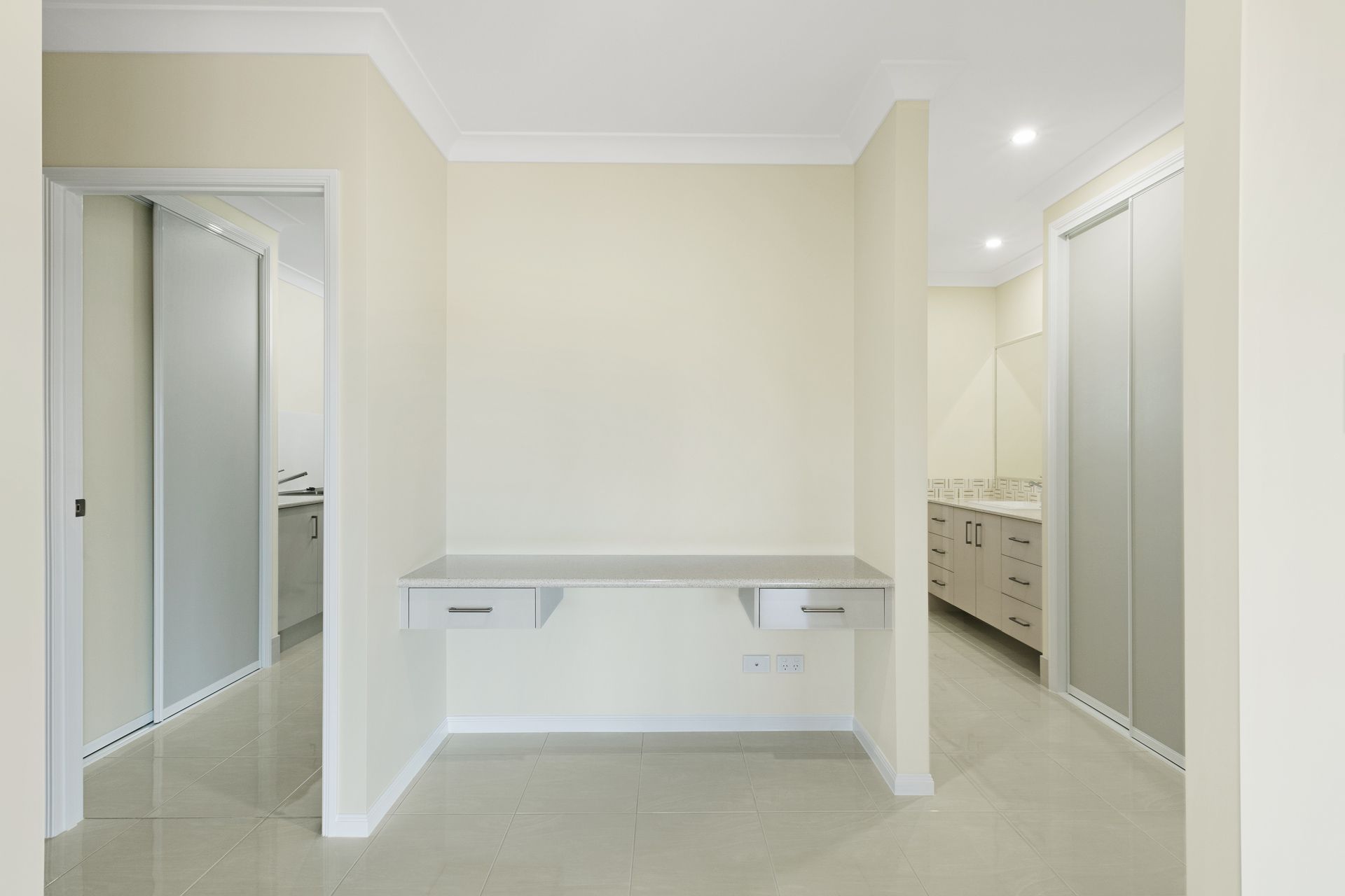 A Neutral-toned Study Nook Featuring a Wall-mounted Desk — Ashlee Jones Homes in Gordonvale, QLD