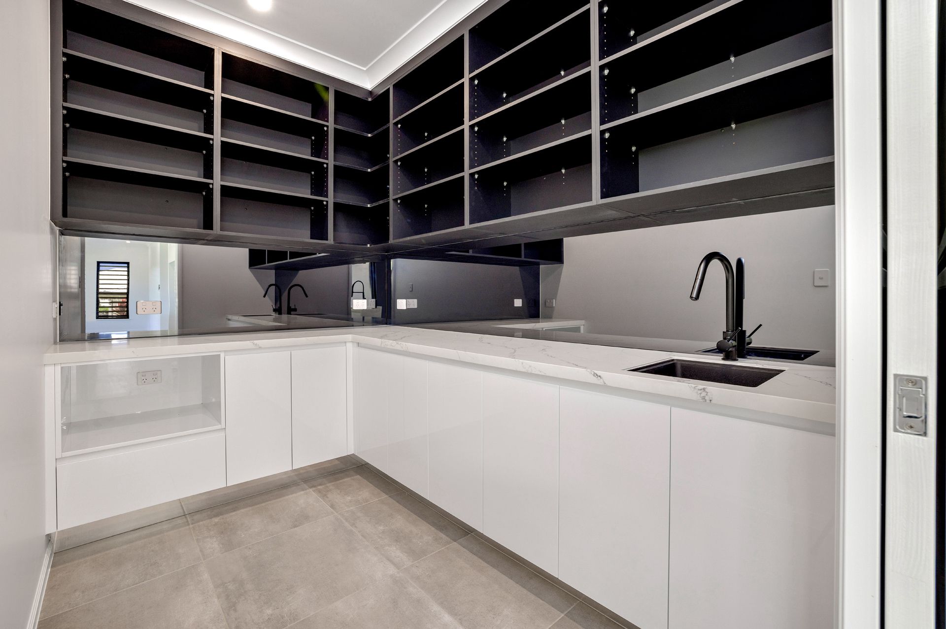 Modern Butler’s Pantry With White Cabinets — Ashlee Jones Homes in Gordonvale, QLD