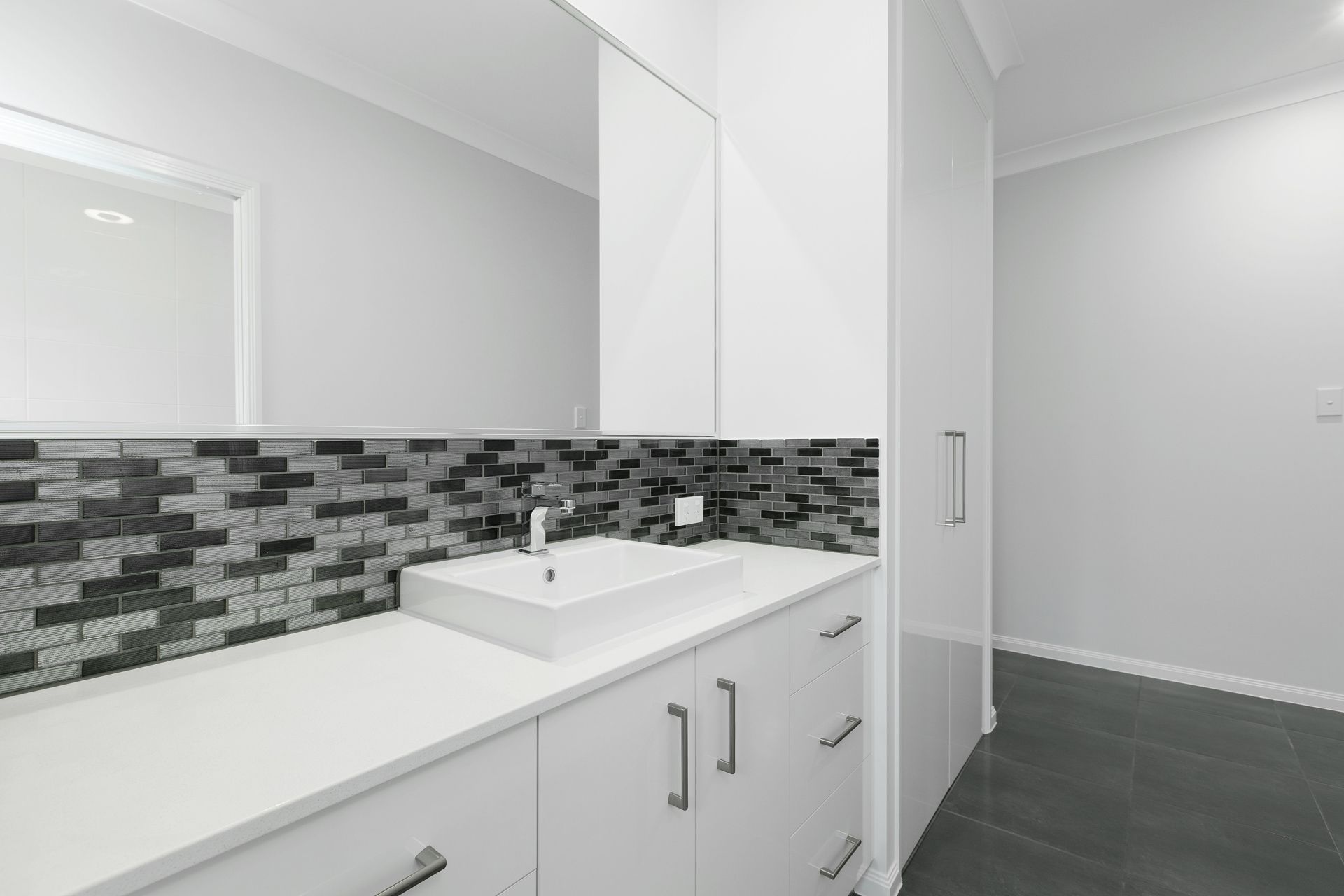 Modern Bathroom Vanity With a White Countertop — Ashlee Jones Homes in Gordonvale, QLD