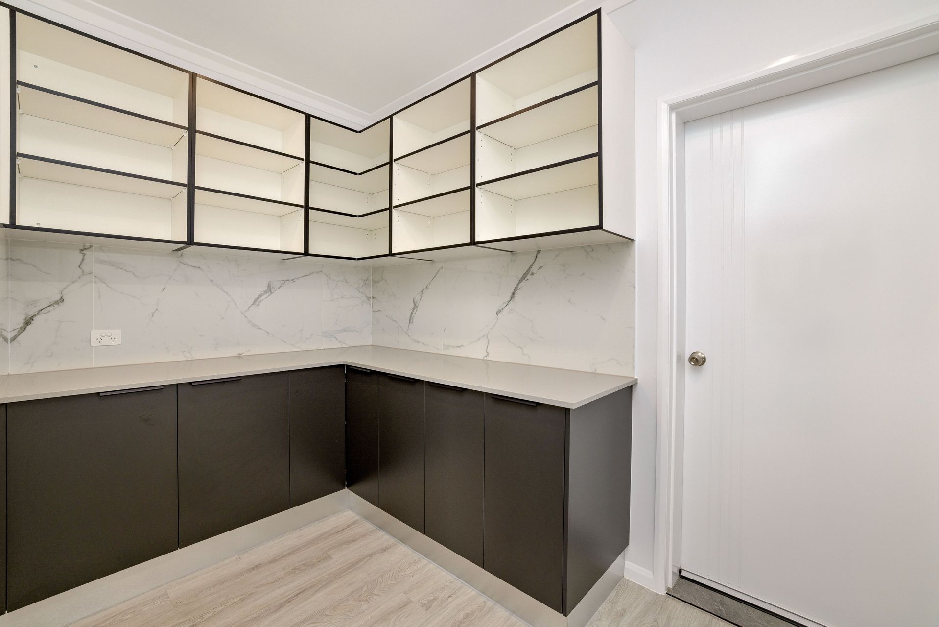 Modern Pantry With Dark Lower Cabinets, Light Marble-style Countertops — Ashlee Jones Homes in Gordonvale, QLD
