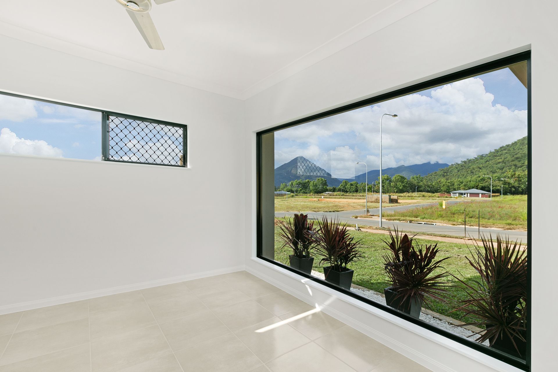 A Bright, Modern Empty Room With White Walls — Ashlee Jones Homes in Gordonvale, QLD