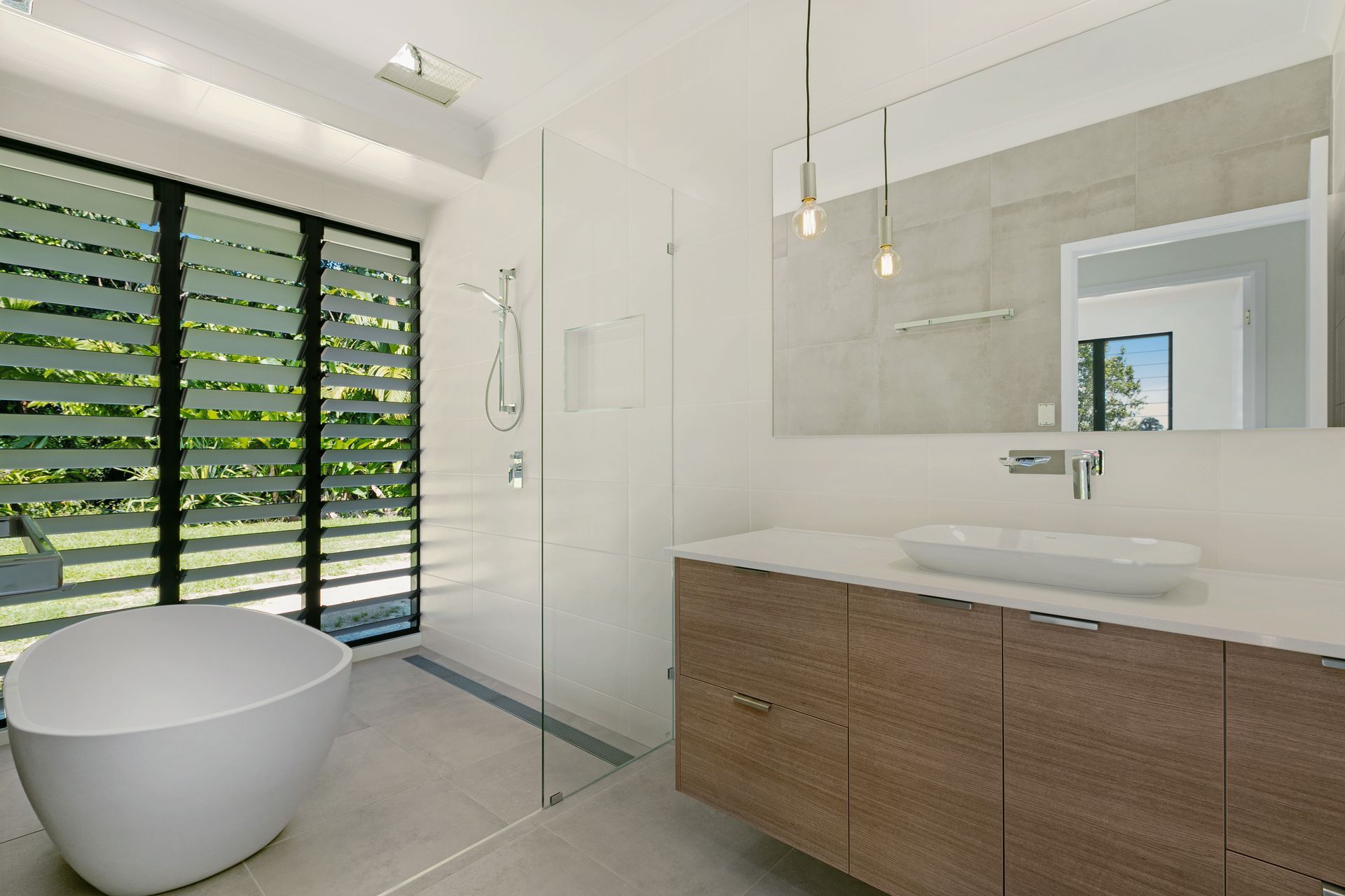 Modern Bathroom With a Freestanding White Tub — Ashlee Jones Homes in Gordonvale, QLD