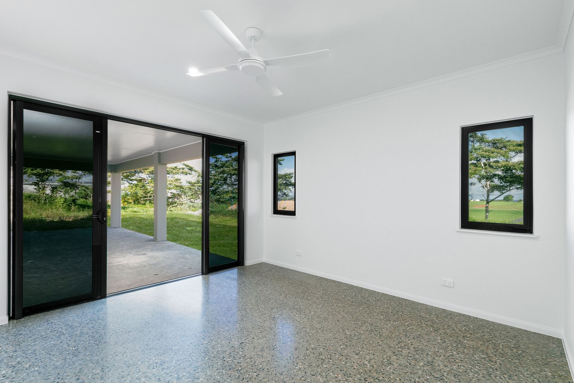 A Modern, Minimalist Room With Plain White Walls — Ashlee Jones Homes in Gordonvale, QLD