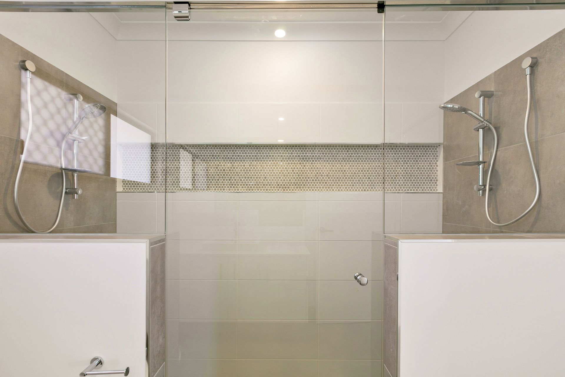 A Modern Walk-in Shower With a Glass Door — Ashlee Jones Homes in Gordonvale, QLD