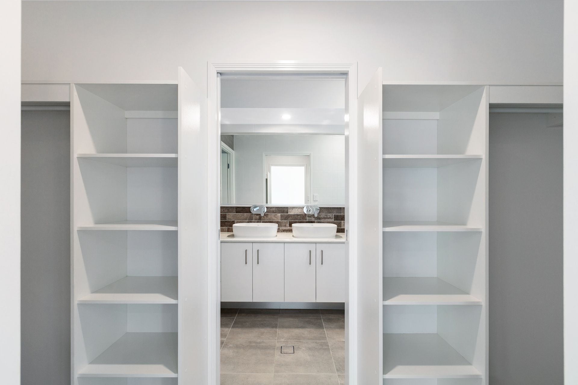 A Bright, Modern Bathroom Entryway — Ashlee Jones Homes in Gordonvale, QLD