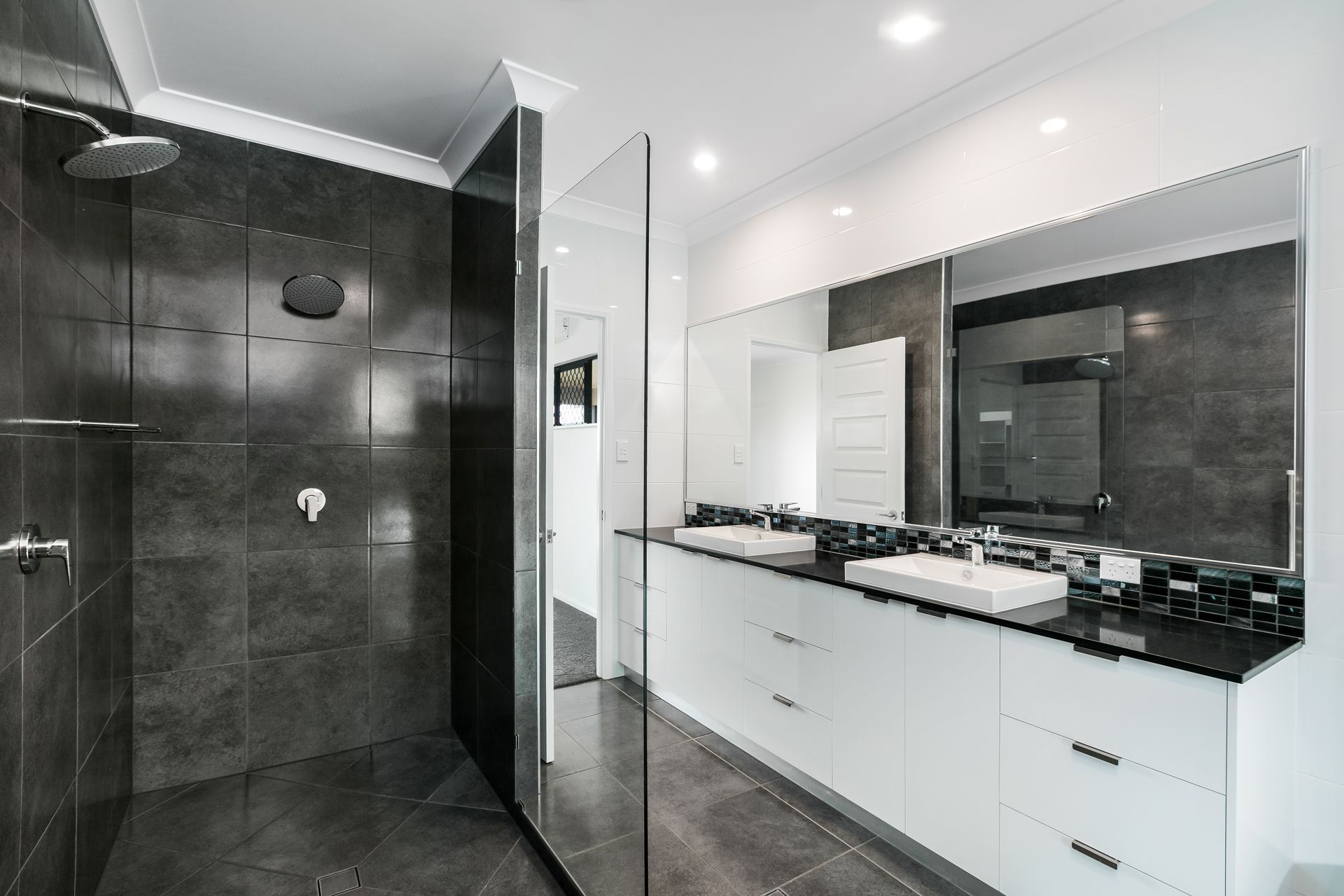 Modern Bathroom With a Glass-enclosed Shower — Ashlee Jones Homes in Gordonvale, QLD