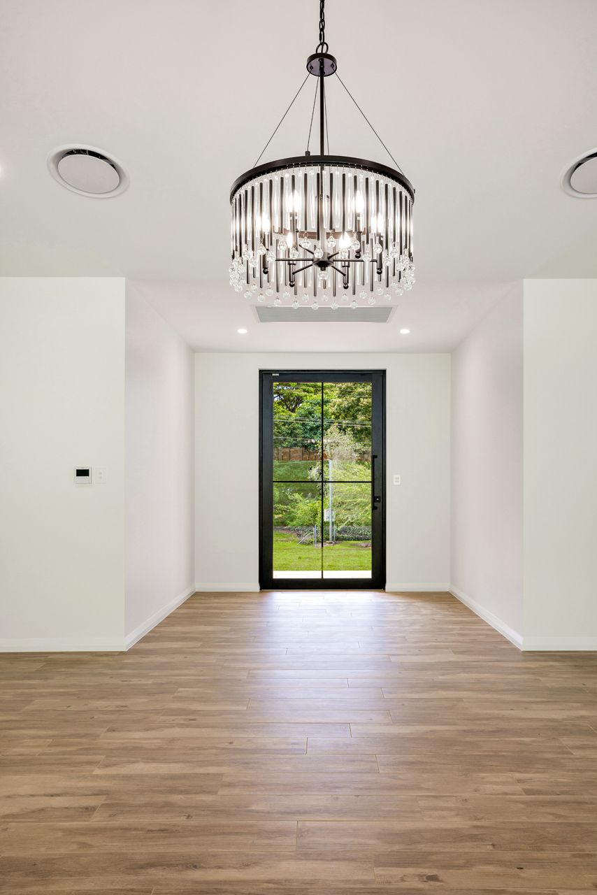 A Light-filled Room With Light Wood Floors — Ashlee Jones Homes in Gordonvale, QLD
