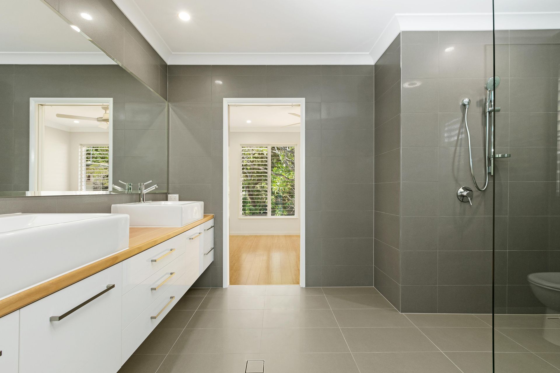 Modern Bathroom With a Double White Vanity — Ashlee Jones Homes in Gordonvale, QLD