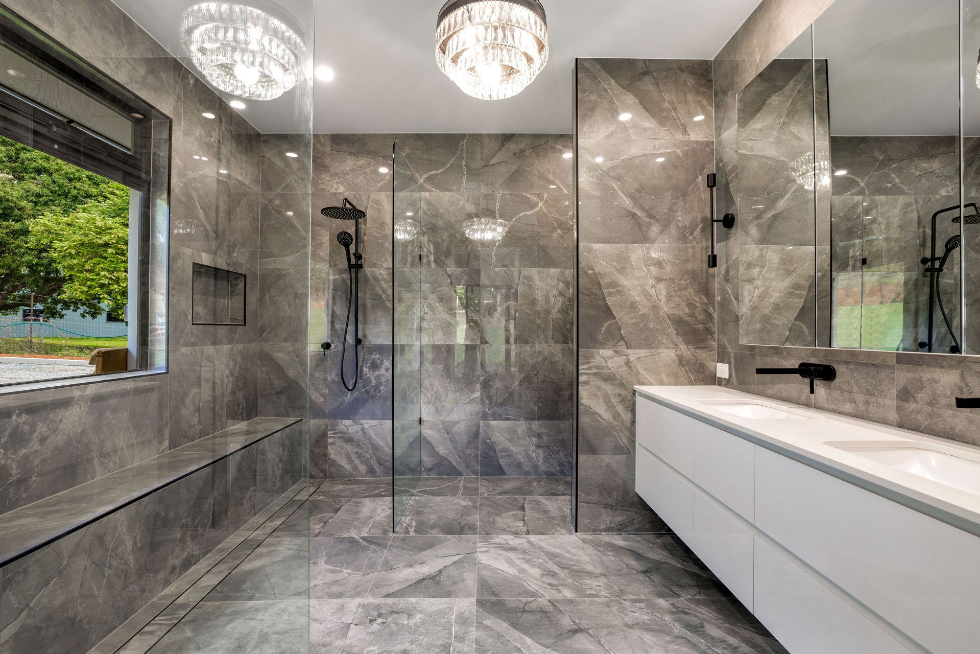 Modern Bathroom With Grey Marble Walls and Floors — Ashlee Jones Homes in Gordonvale, QLD