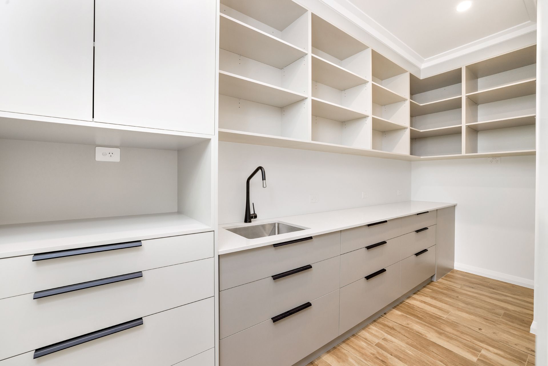 Modern Walk-in Pantry With White Cabinetry — Ashlee Jones Homes in Gordonvale, QLD
