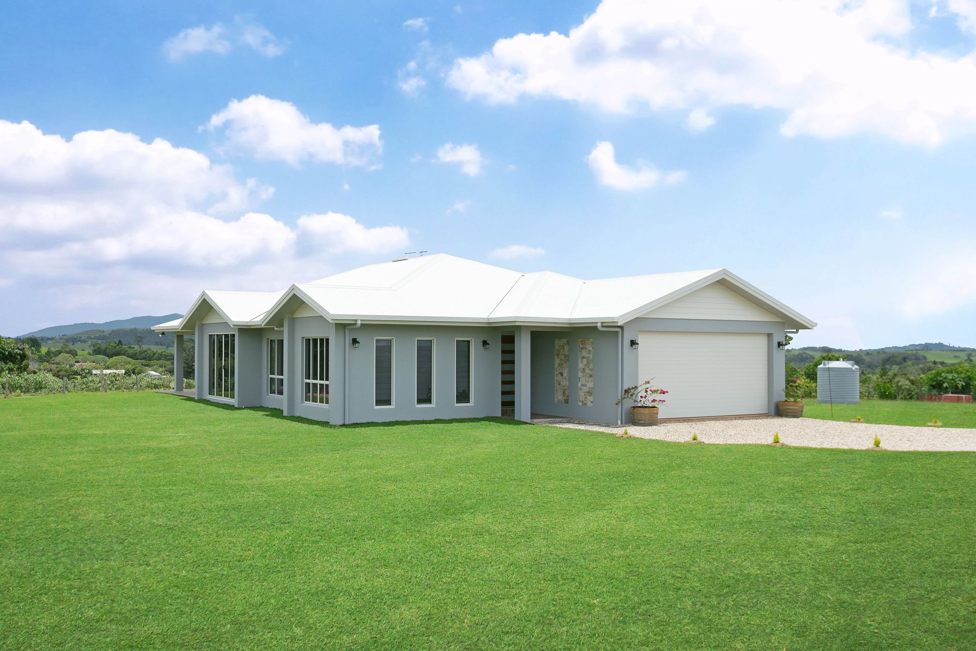 A Modern, Light Gray Single-story House With a White Roof — Ashlee Jones Homes in Gordonvale, QLD