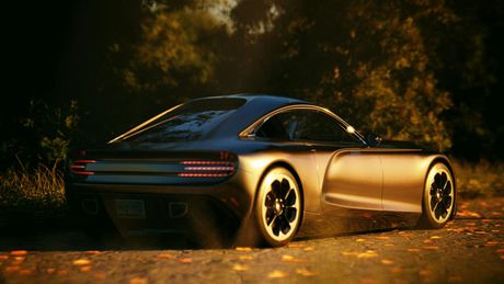Sleek black sports car parked on a leaf-strewn road in warm sunset light