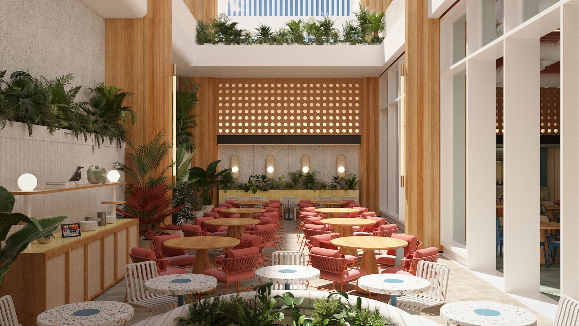 Restaurante em San Andrés com mesas decoradas, plantas tropicais e luz natural no Zapadilly Tree Hotel.