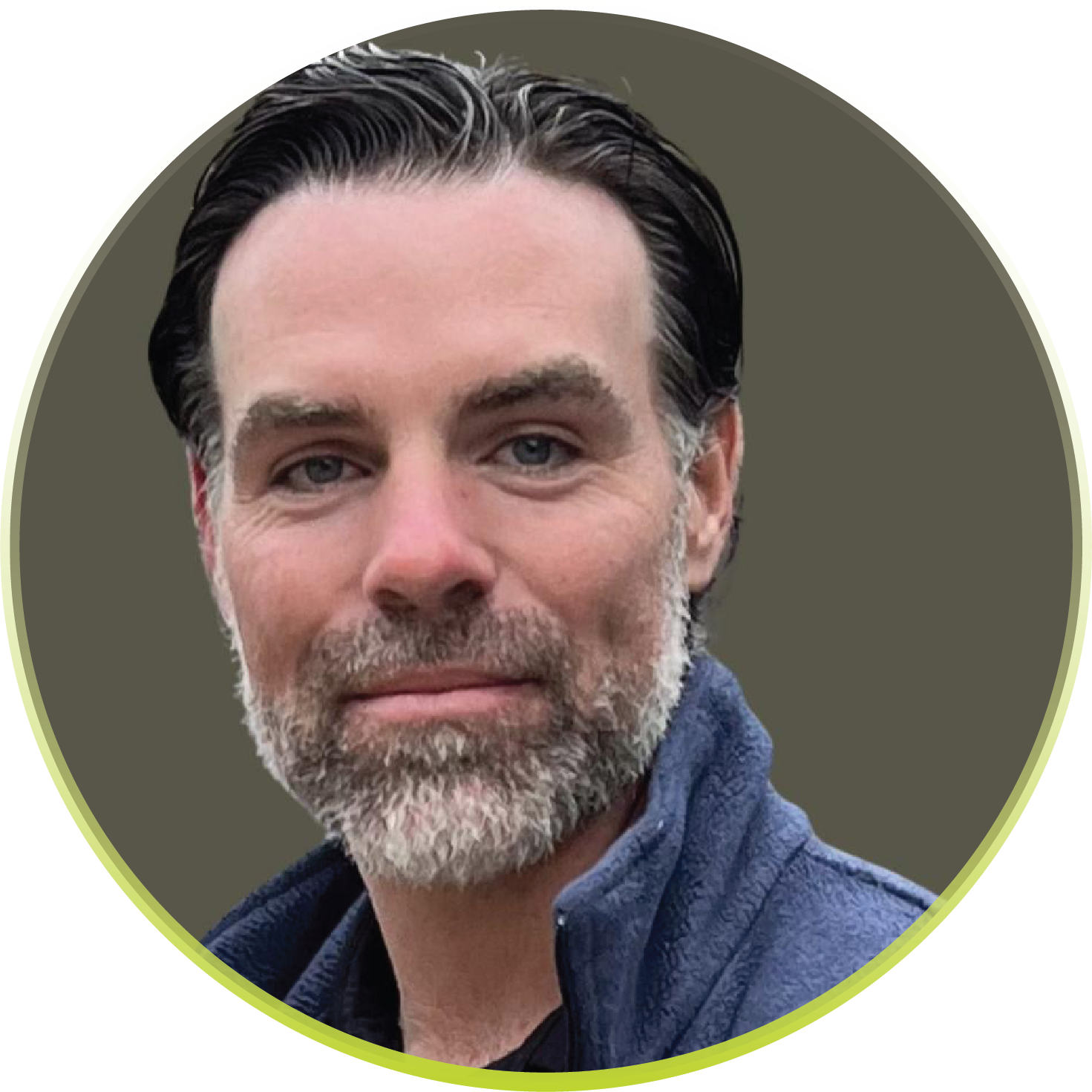 A man with a beard is wearing a blue jacket