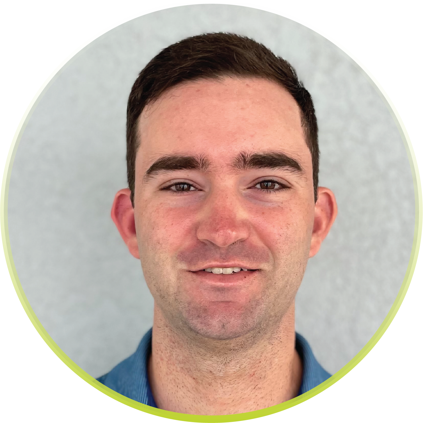 A man in a blue shirt is smiling in a circle