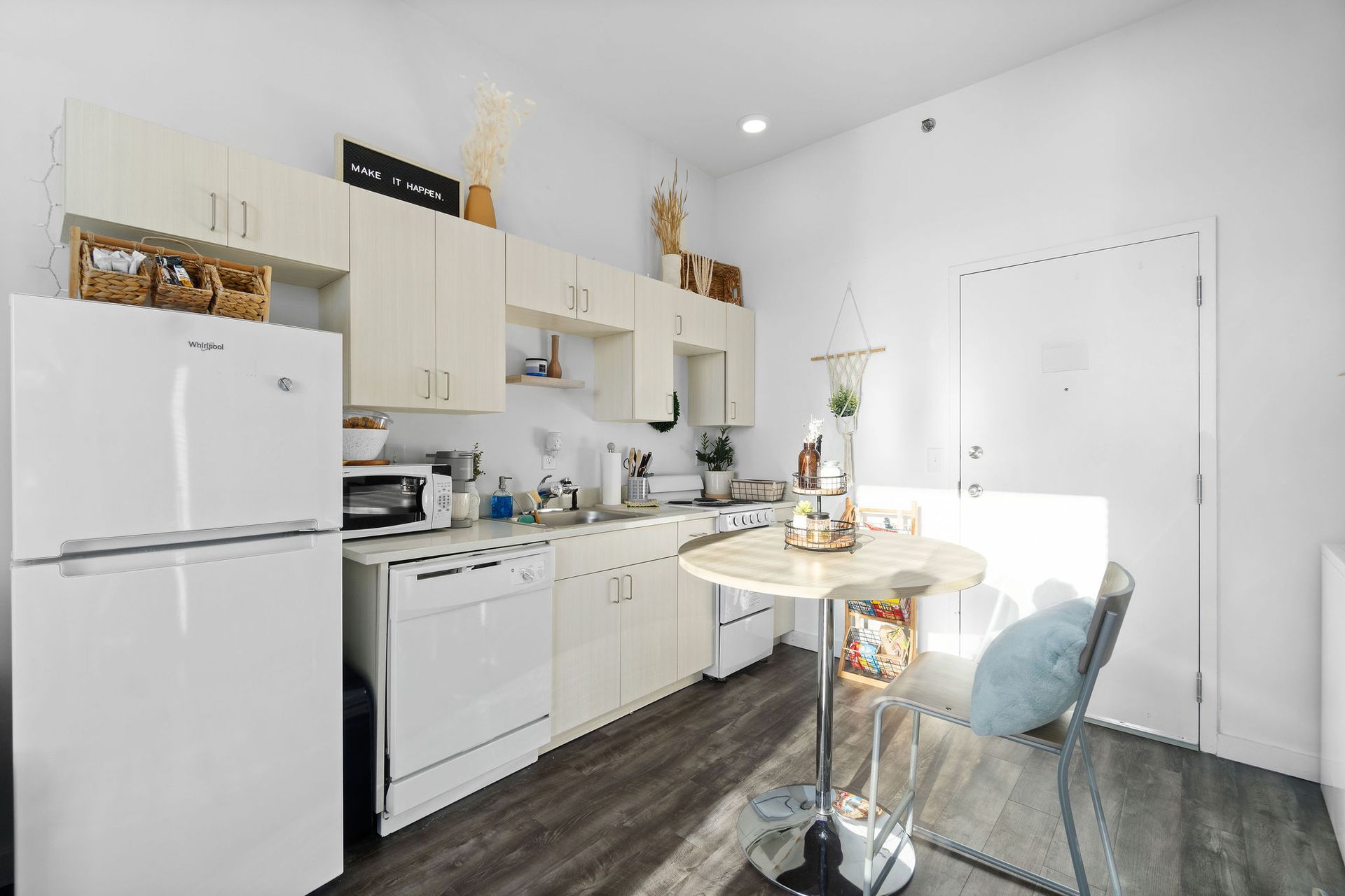 Photo showing a kitchen and small dining area