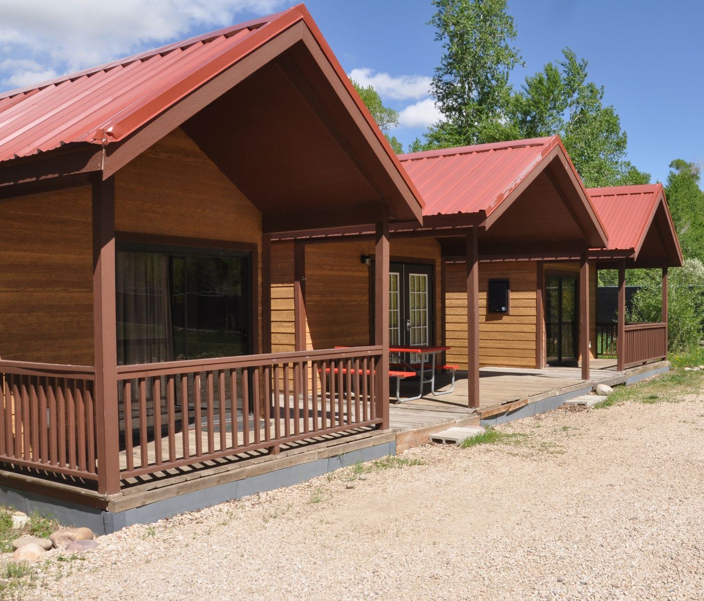 A row of small cabins with red roofs