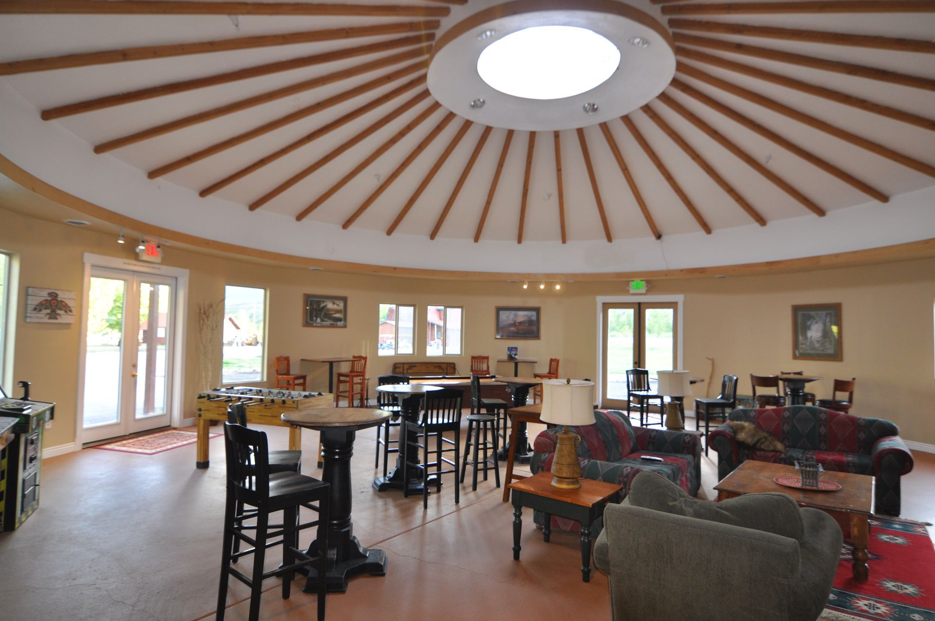 A large room with tables and chairs in it