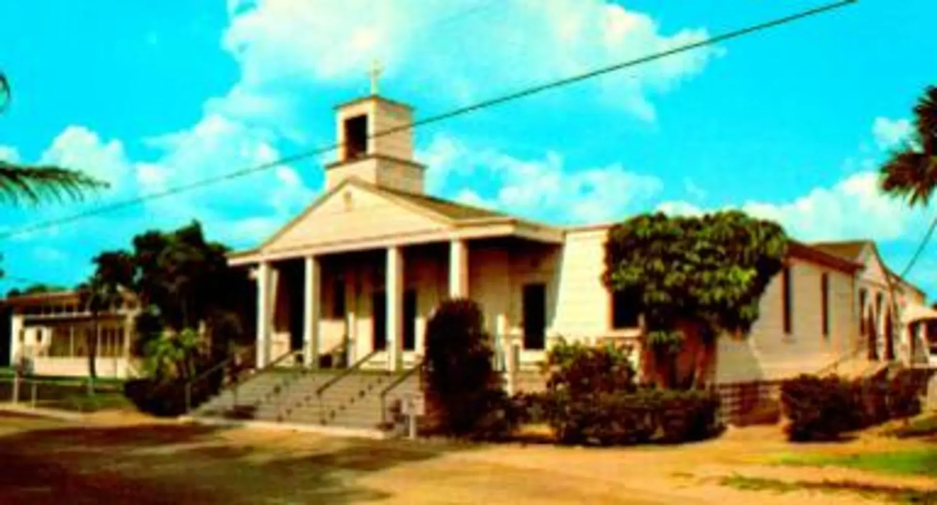 A painting of a church with a blue sky in the background