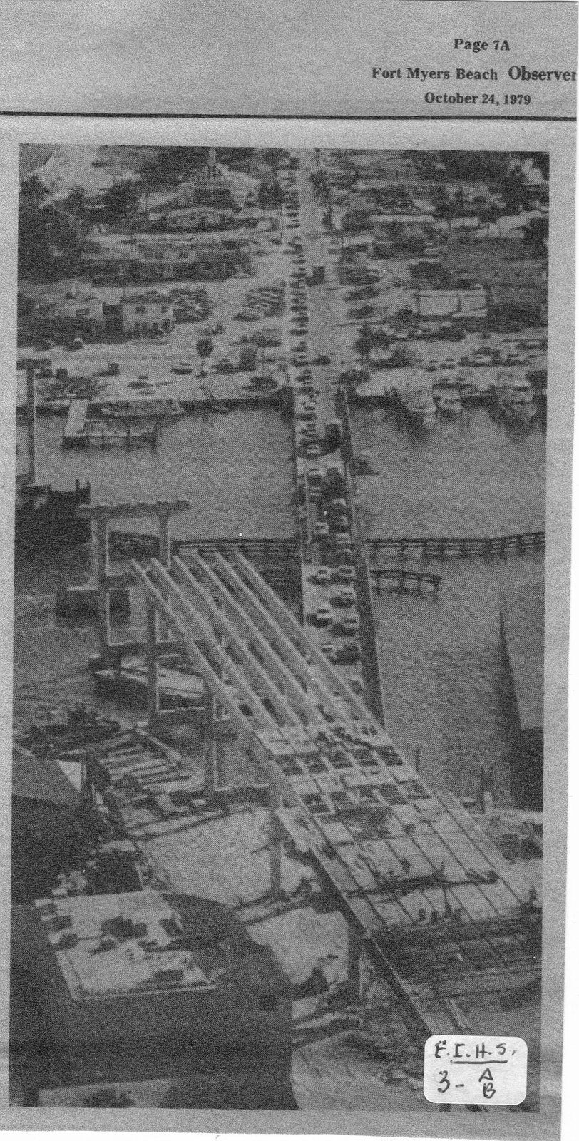 A black and white photo of a bridge under construction