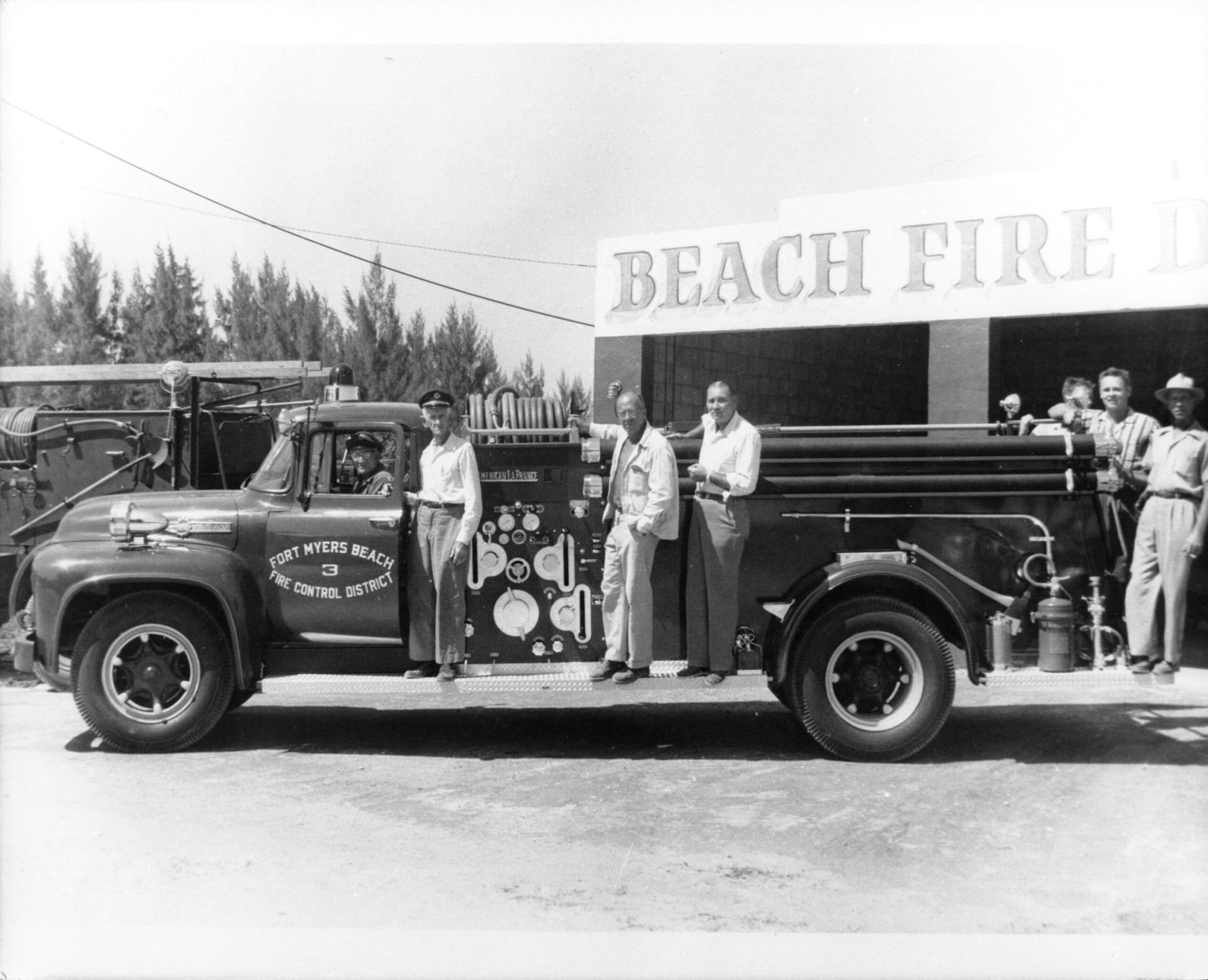 A black and white photo of a beach fire station