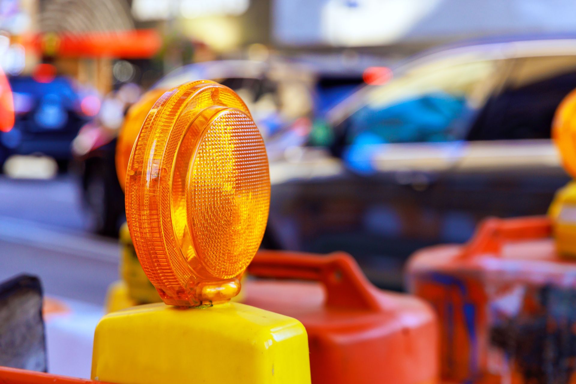 Traffic control warning light on roadwork barricade for safety management