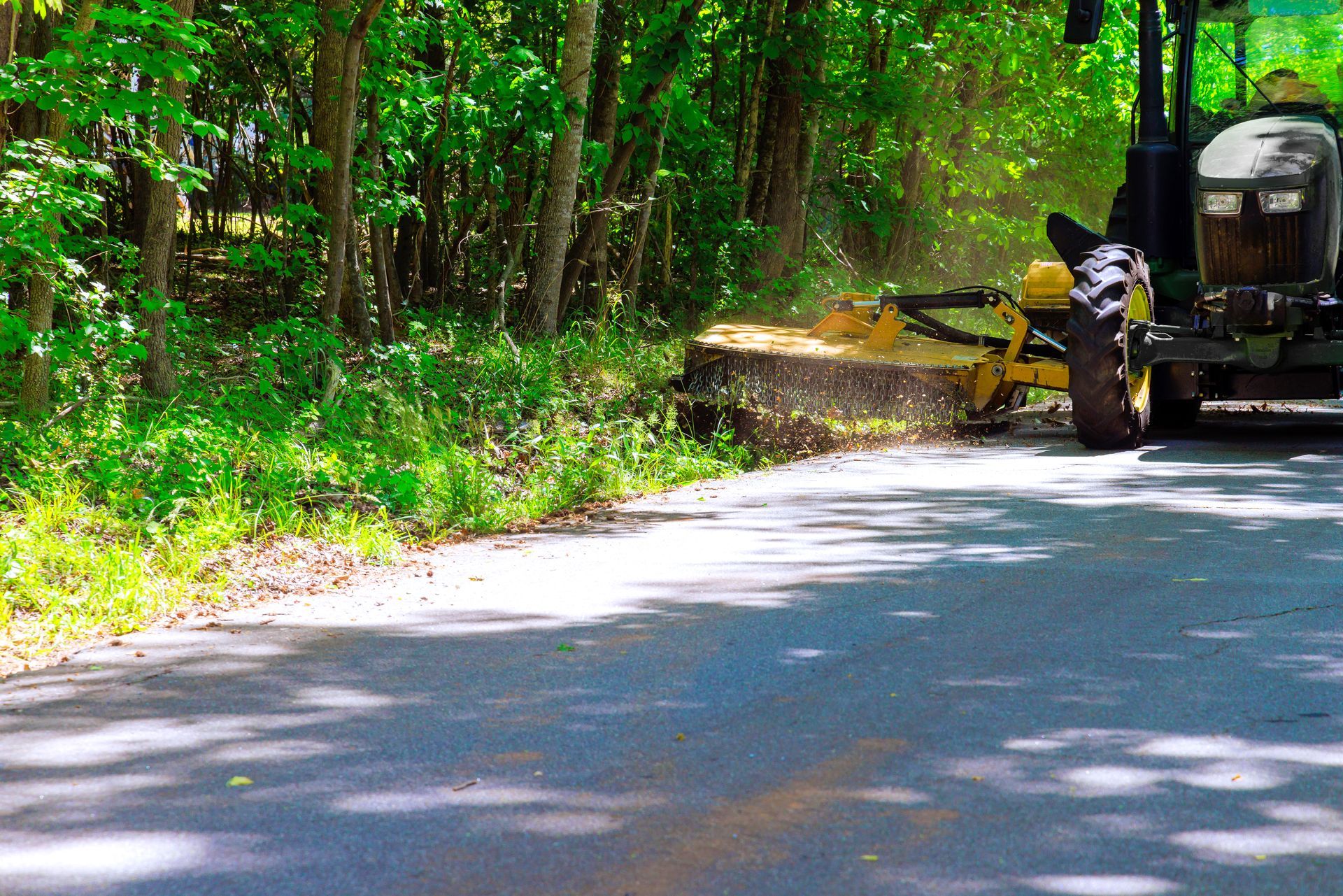 Roadside mowing and right-of-way maintenance along paved road