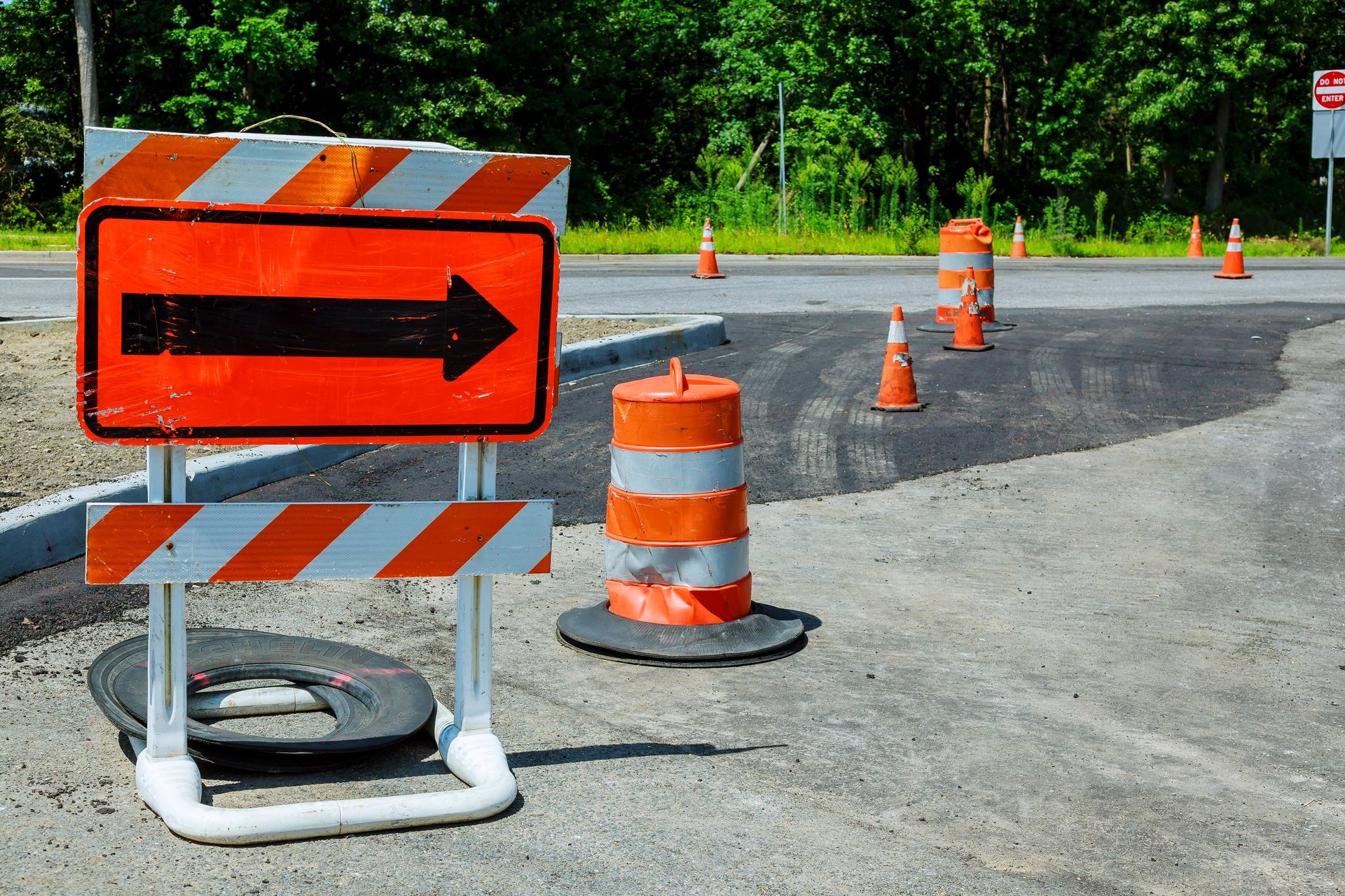 Road detour sign with traffic cones for construction traffic management