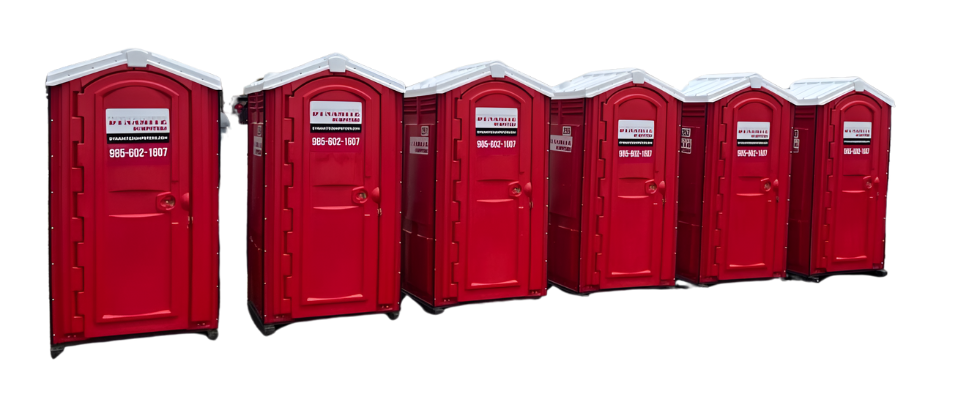 A row of red portable toilets are lined up in a row on a white background.