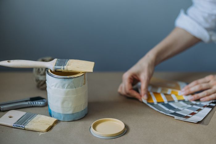 Woman Testing Color Paint — Reno, NV — Parker’s Painting Inc.
