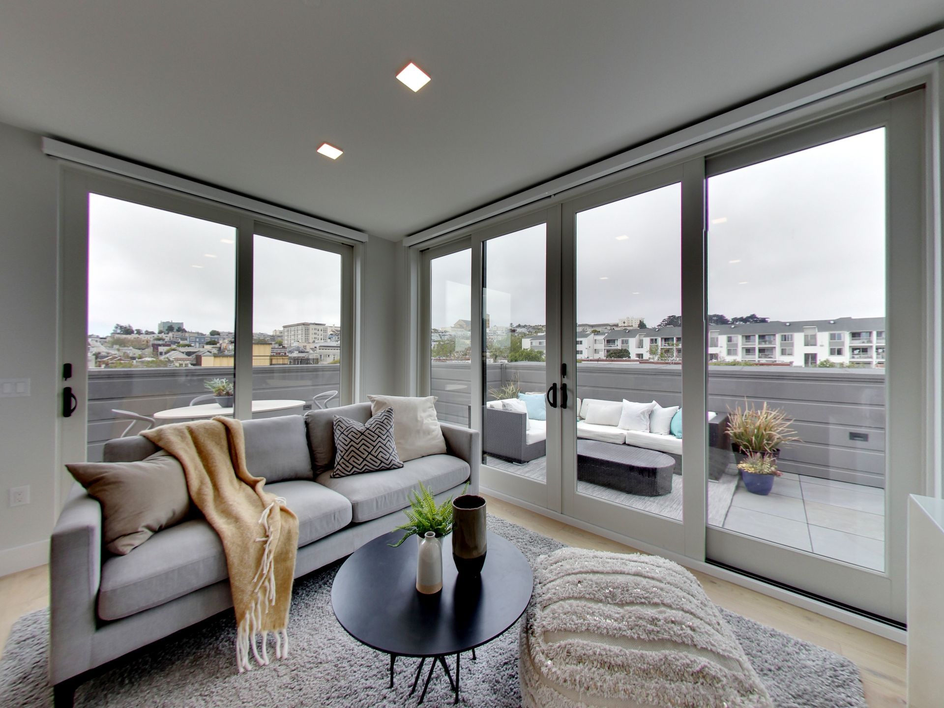 Englander Residences -  Living room with large windows