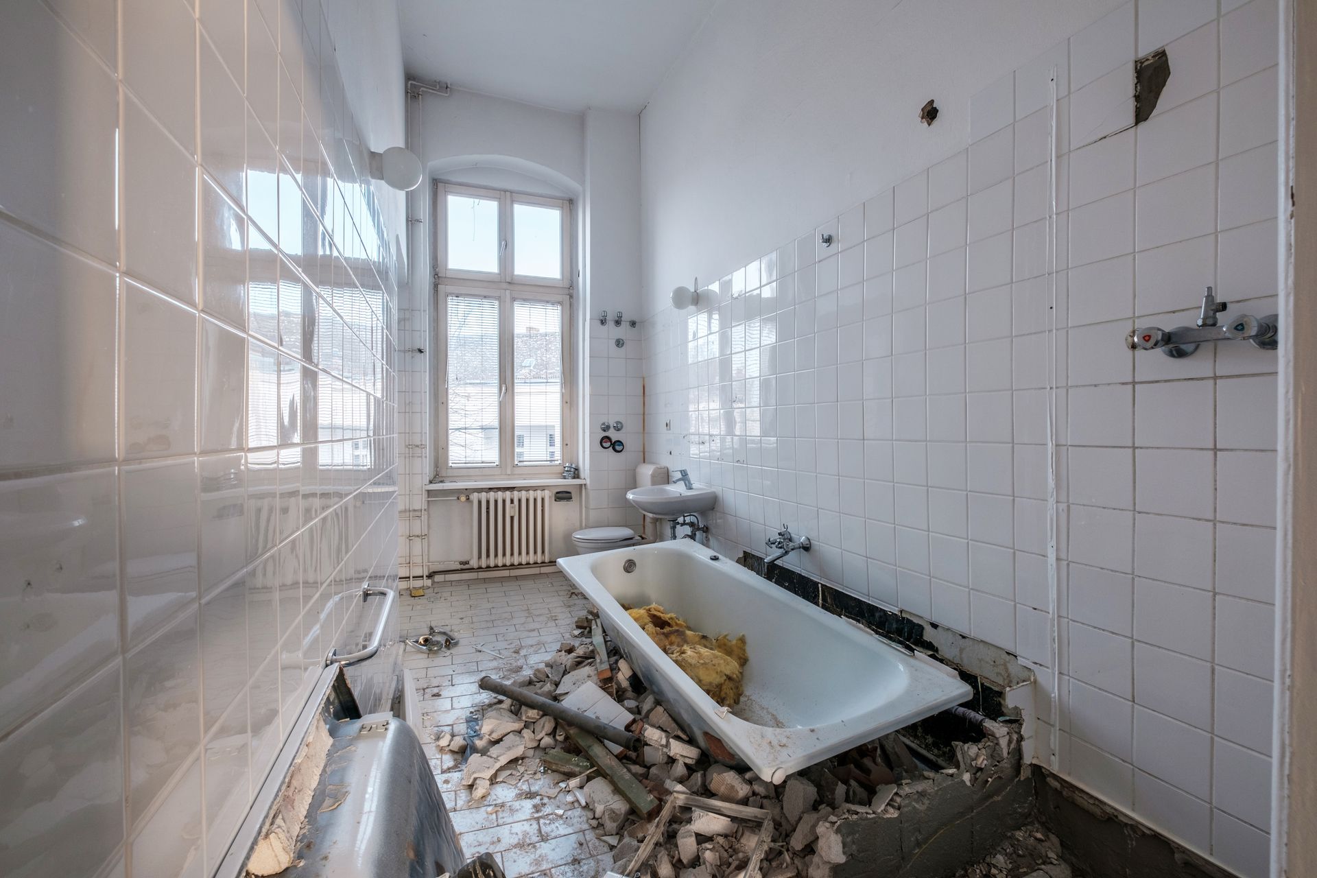 A bathroom with a bathtub and a sink in it.