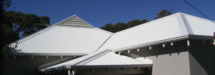White-roofed building under a clear blue sky