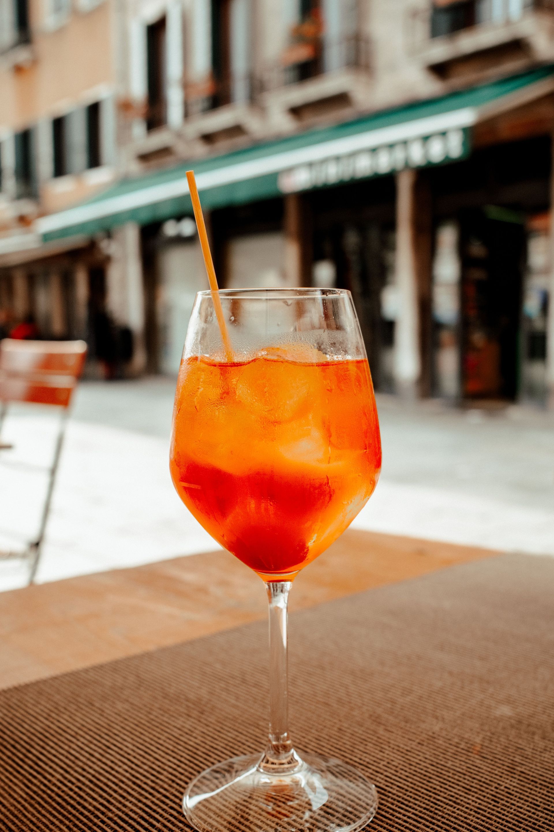 The classic Venetian spritz—a bright, sparkling combination of Aperol, Prosecco, soda water, and orange.