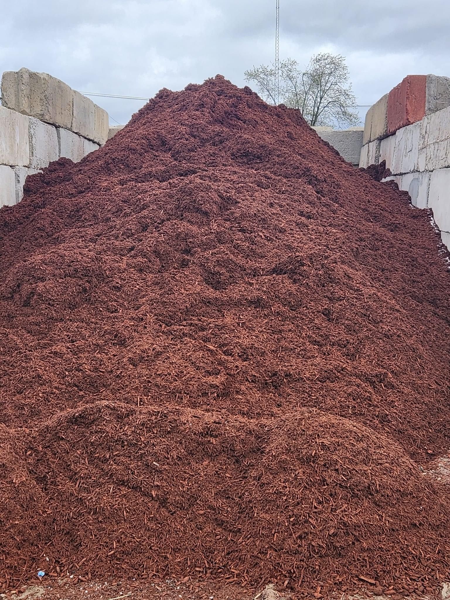 Dark hardwood bulk mulch pile at a Livonia Michigan landscape supply yard