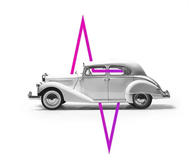 A vintage, white luxury car is bisected by a sharp, magenta geometric graphic resembling an abstract lightning bolt.