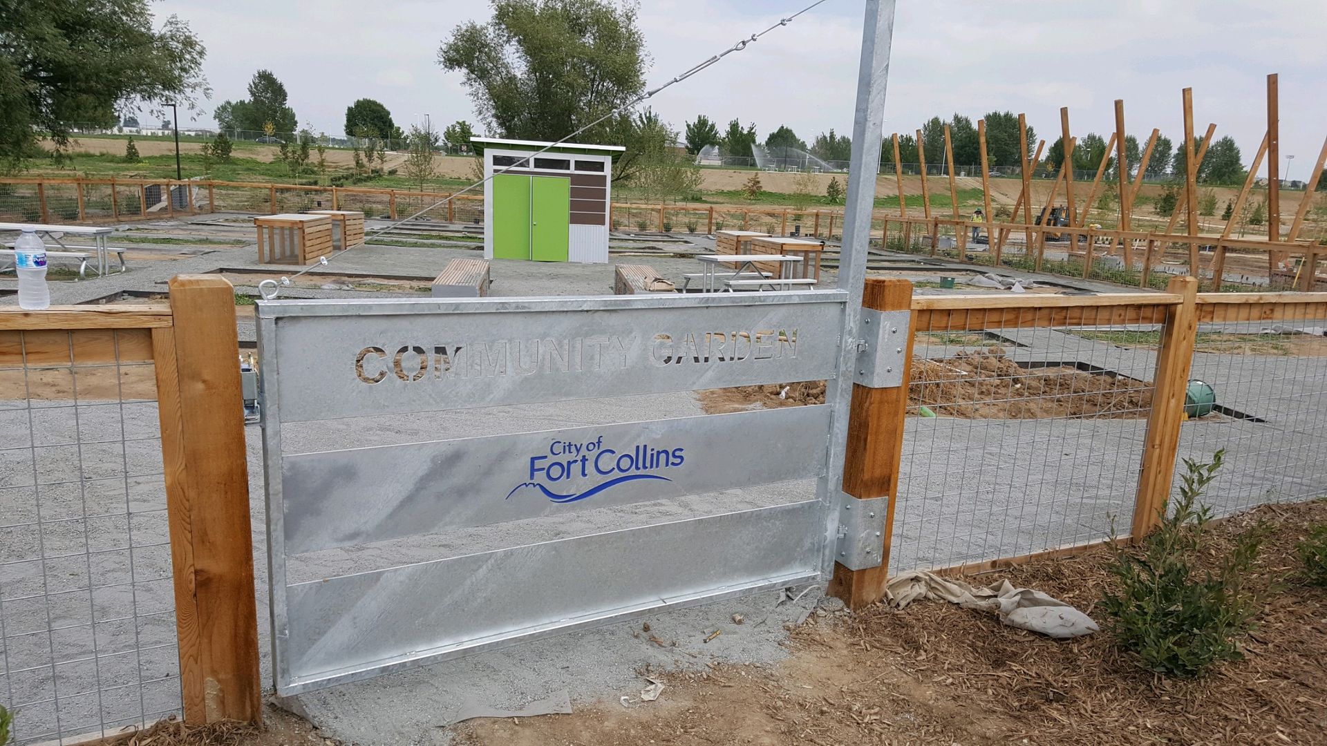 A metal gate built by Greater Western Fence with the word community written on it