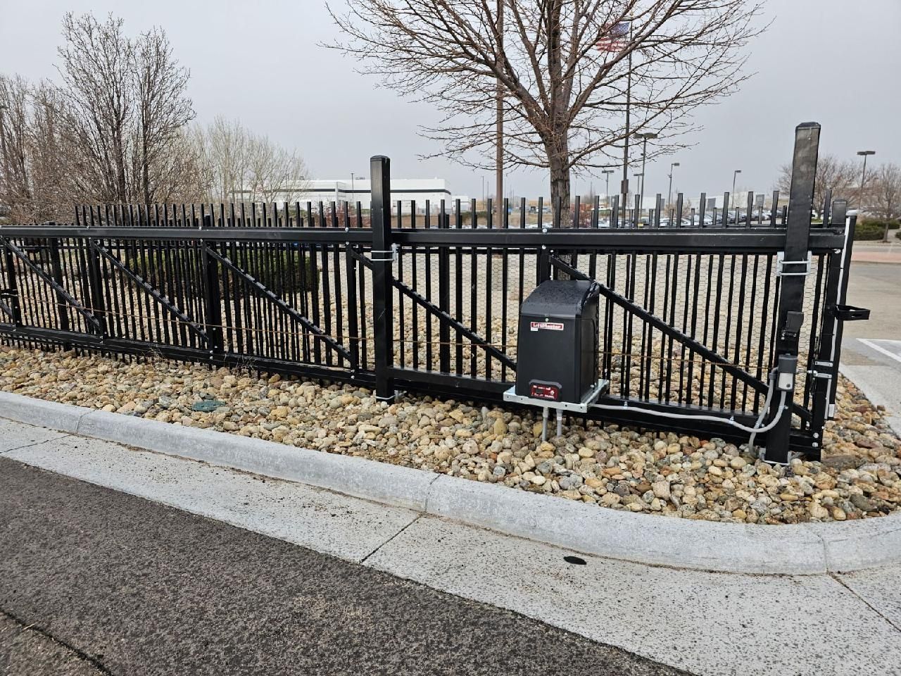 A sliding gate built by Greater Western Fencewith a motor attached to it