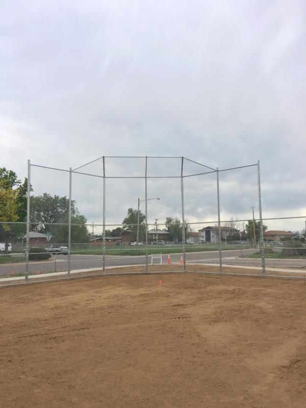 A baseball field with a fence around it buit by Greater Western Fence
