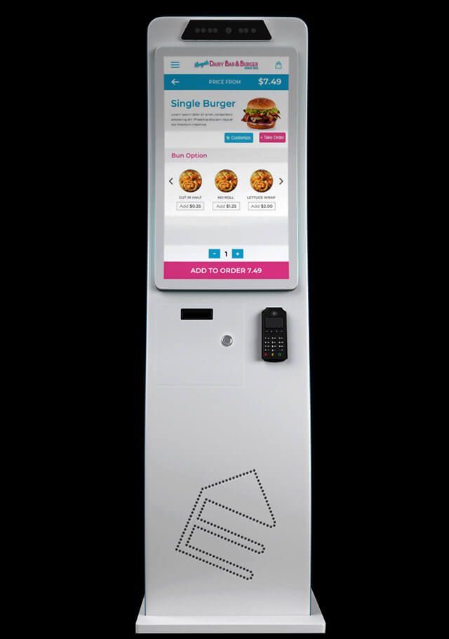 White food ordering kiosk with touch screen displaying menu.  A credit card reader and keypad are on the front.