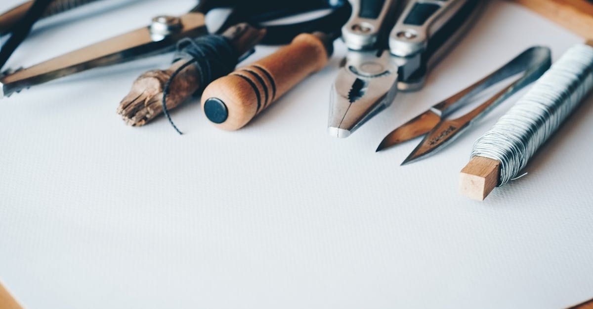 A bunch of tools are sitting on top of a piece of paper.