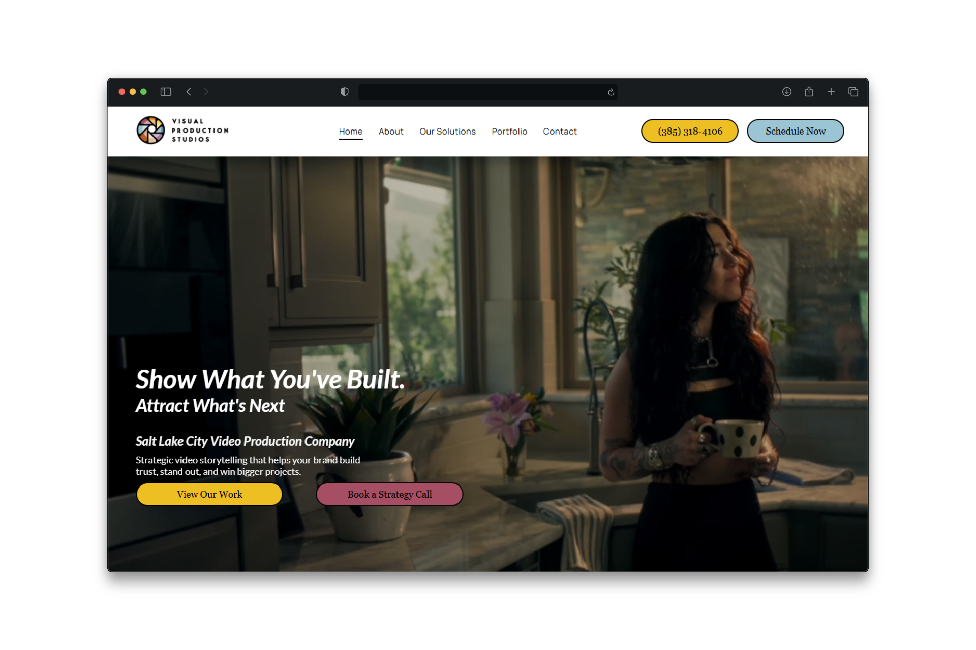 Website landing page featuring a woman in a kitchen, text 