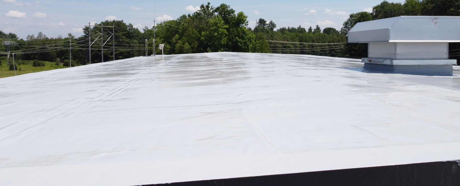 Commercial flat roof with liquid applied roofing membrane
