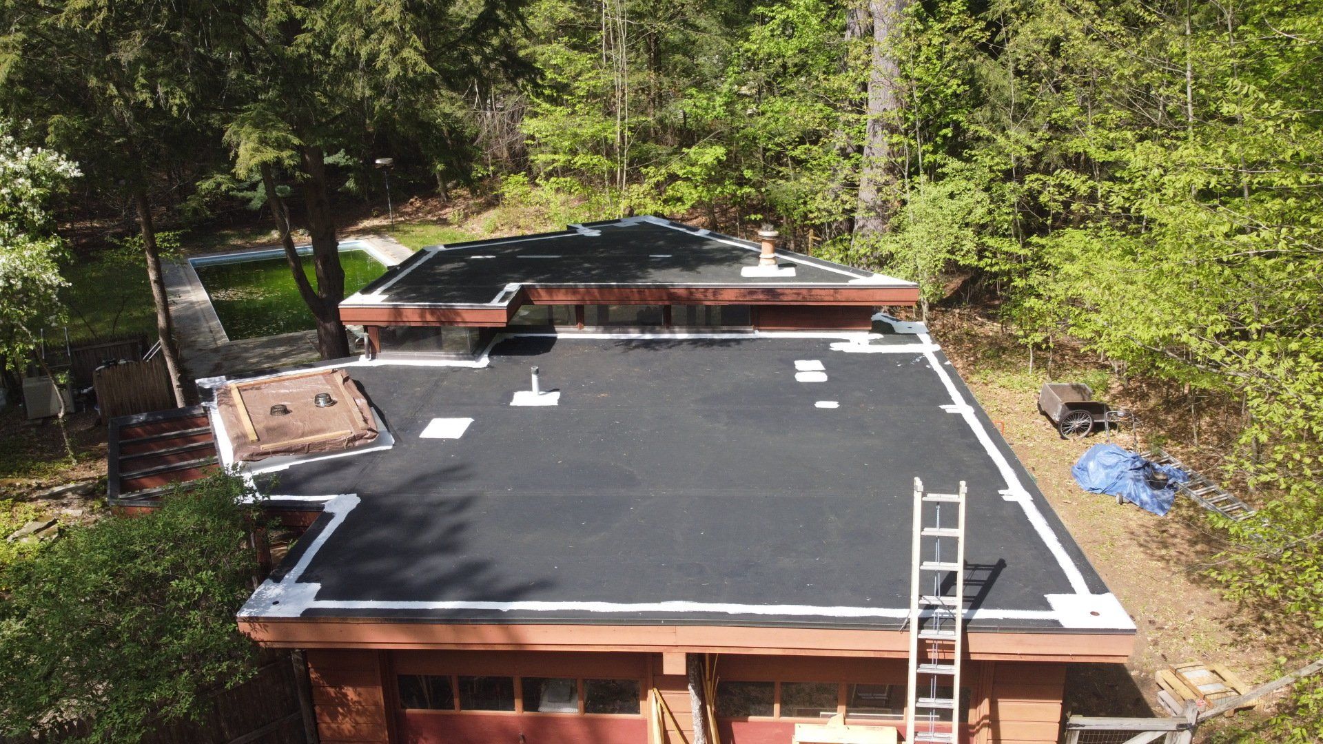 A residential home getting a new roof installed 