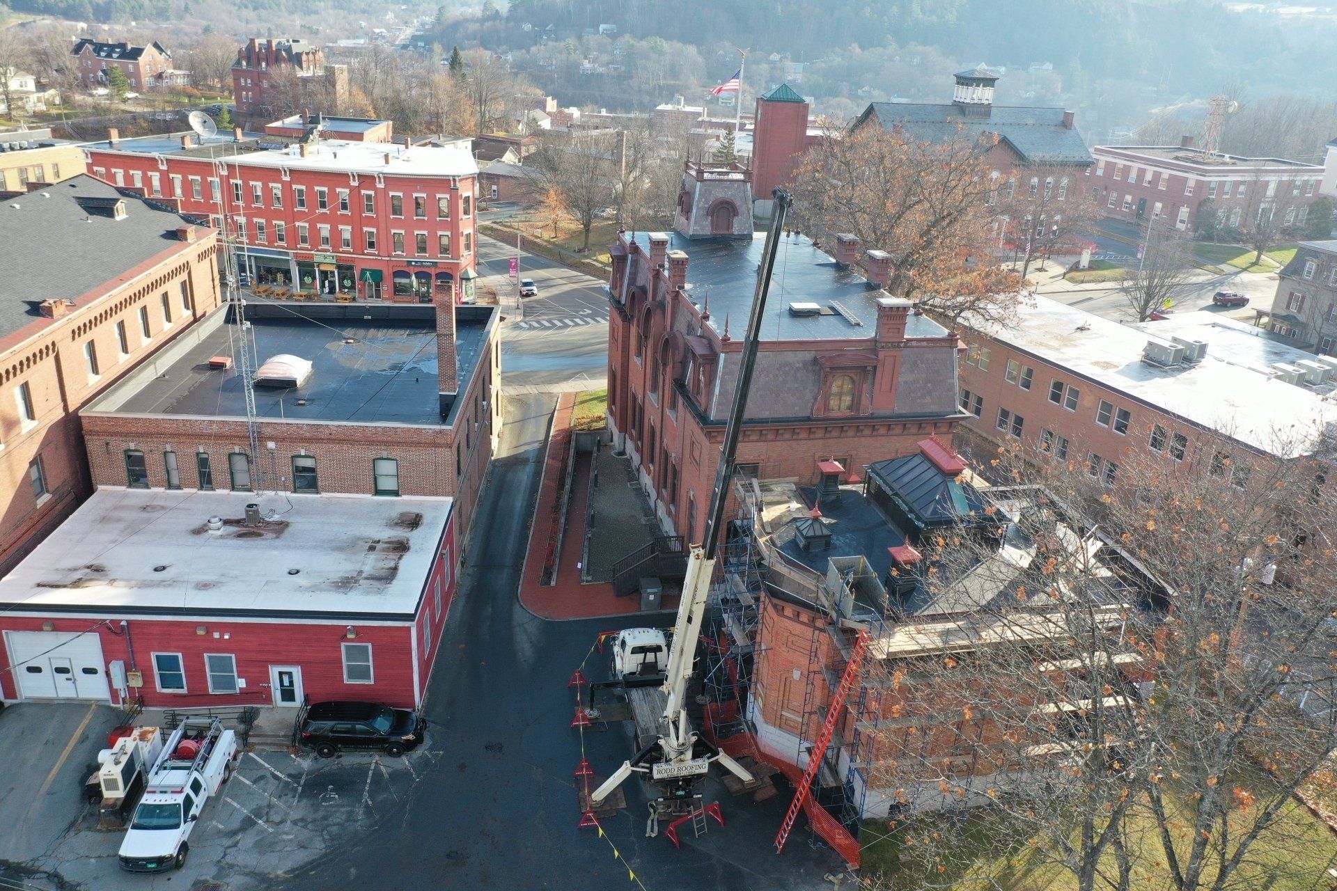 An overhead shot of the St. Johnsbury Athenaeum and Rodd Roofing equipment