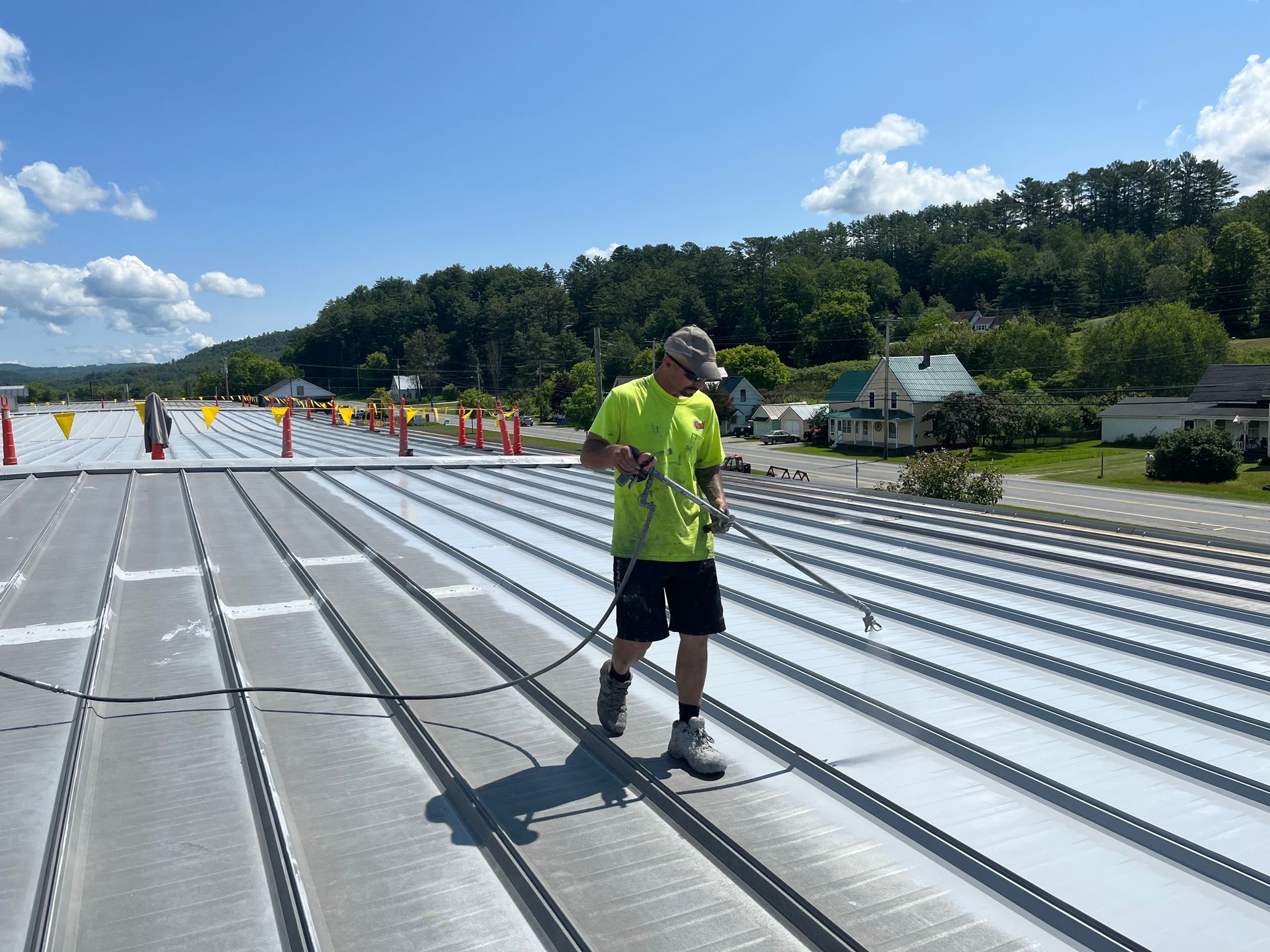 Ritchie Lafleur coating a roof for Rodd Roofing