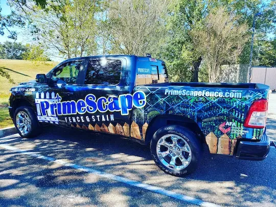PrimeSoape branded pickup truck parked outdoors among trees and shade