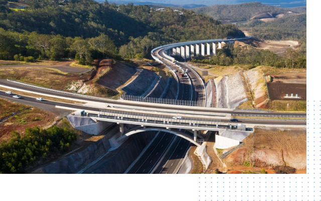 An aerial view of a highway with a bridge over it.